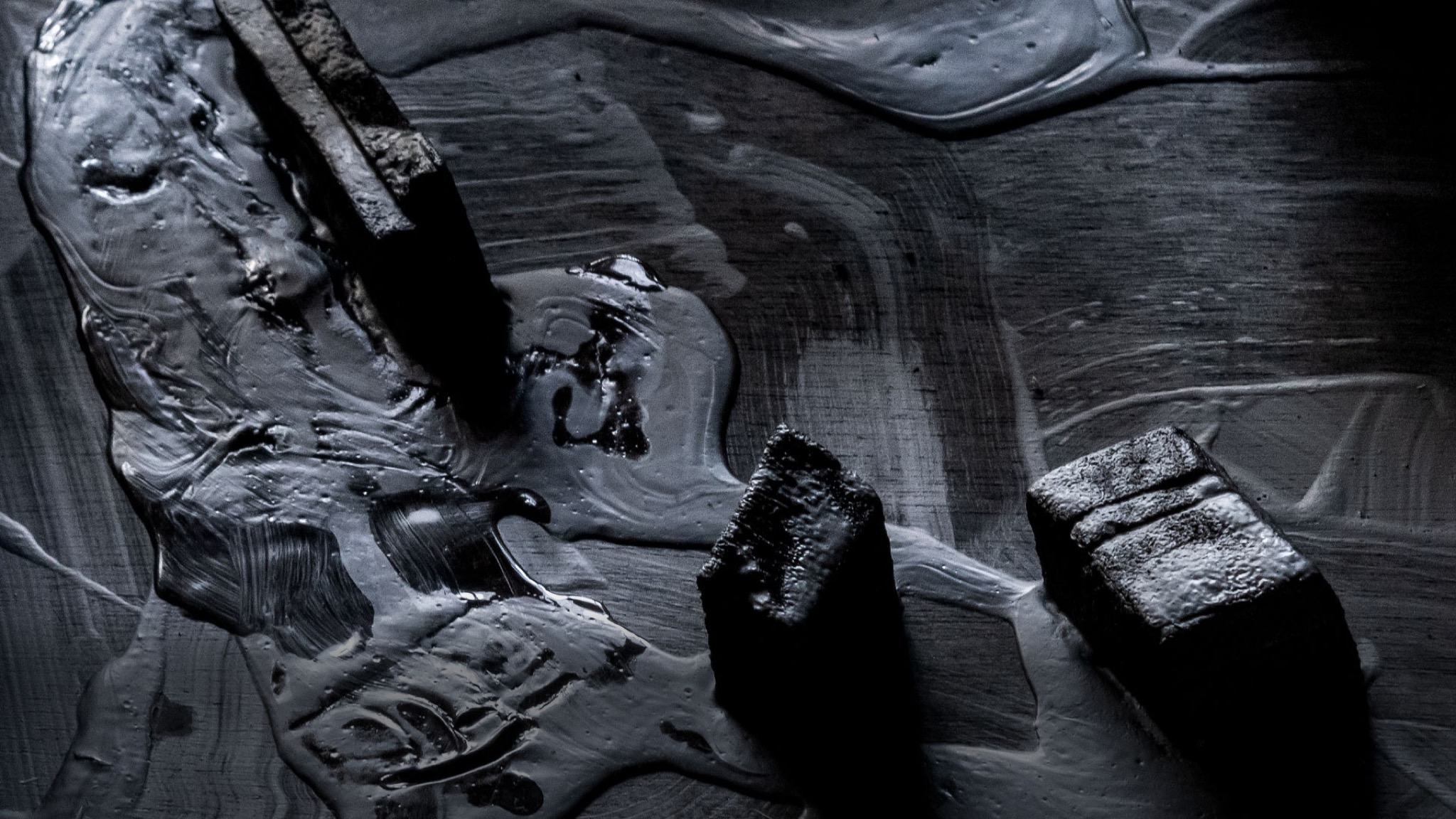 Detail. The painted surface, where the black spreads and pools like oil on water